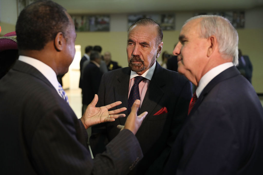 MIAMI, FL - APRIL 12: Jorge Perez, CEO, Related Urban Group and Carlos Gimenez, mayor of Miami-Dade, (L-R) speak with U.S. Housing and Urban Development Secretary Ben Carson during a visit to the Liberty Square apartment complex on April 12, 2017 in Miami, Florida. Secretary Carson is on a national listening tour to hear from the people and organizations who rely on and support public housing. (Photo by Joe Raedle/Getty Images)